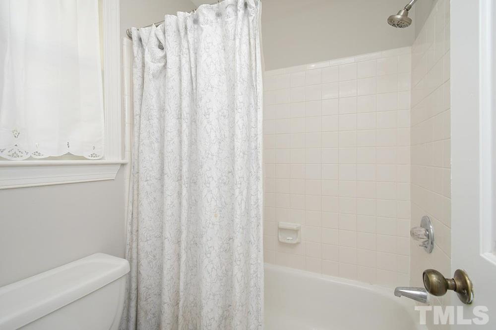 5903 Sentinel Drive Raleigh, NC 27609 - Photo 15 of 26 Tub/shower in Master Bathroom.