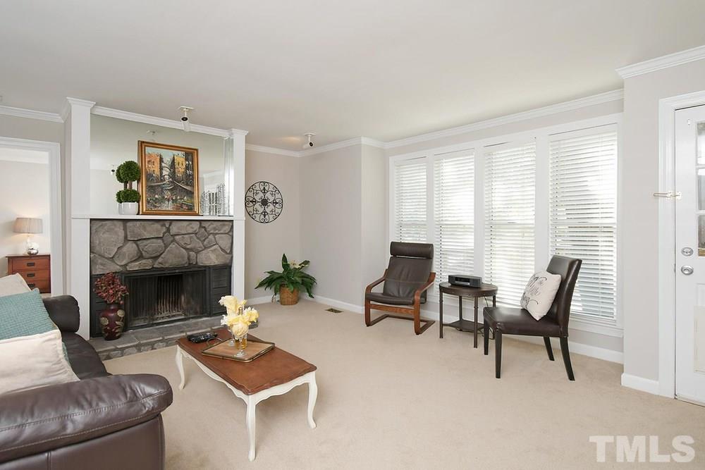 5903 Sentinel Drive Raleigh, NC 27609 - Photo 3 of 26 Family Room with stone fireplace and crown molding.