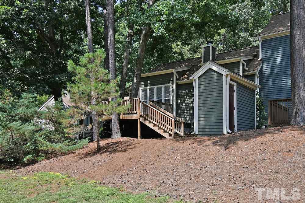 5903 Sentinel Drive Raleigh, NC 27609 - Photo 21 of 26 View of the back deck and stairs down to storage shed.