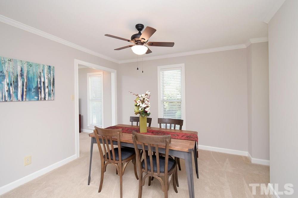 5903 Sentinel Drive Raleigh, NC 27609 - Photo 10 of 26 Separate Dining Room with ceiling fan and crown molding.