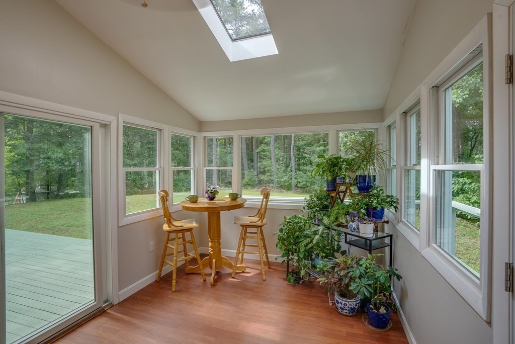 40 Tenney Road Rowley, MA 01969 - Photo 12 of 28 a living room with furniture and garden view