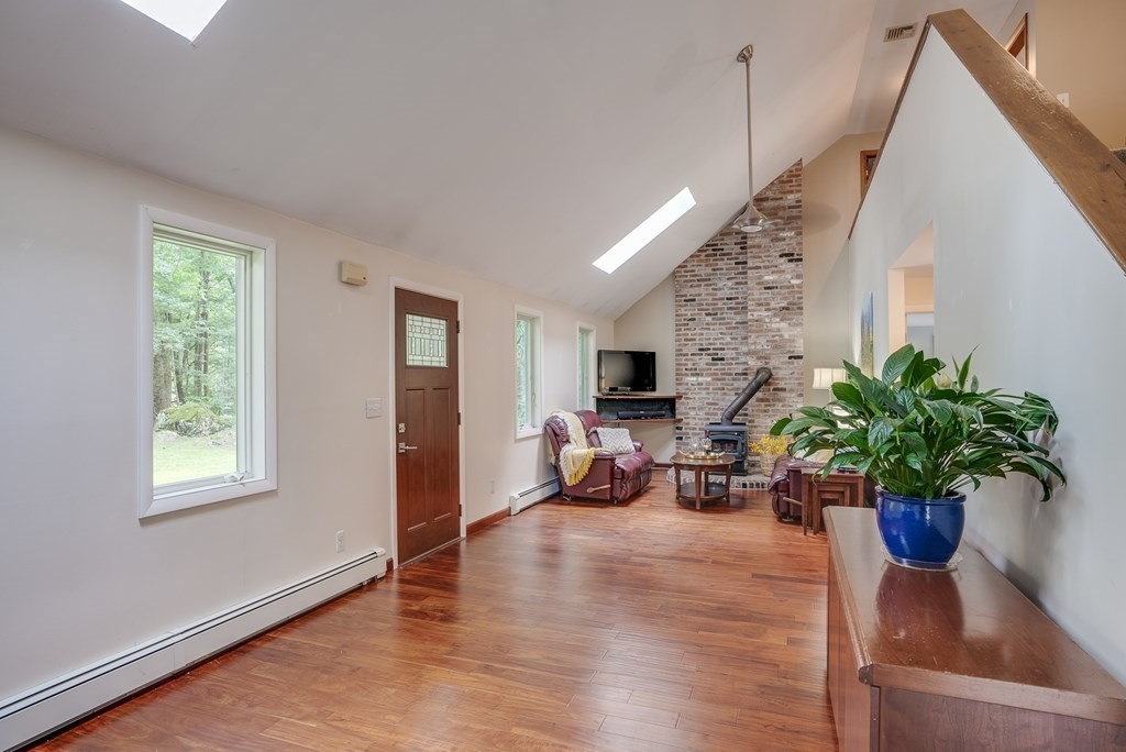 40 Tenney Road Rowley, MA 01969 - Photo 3 of 28 a living room with furniture potted plant and a window