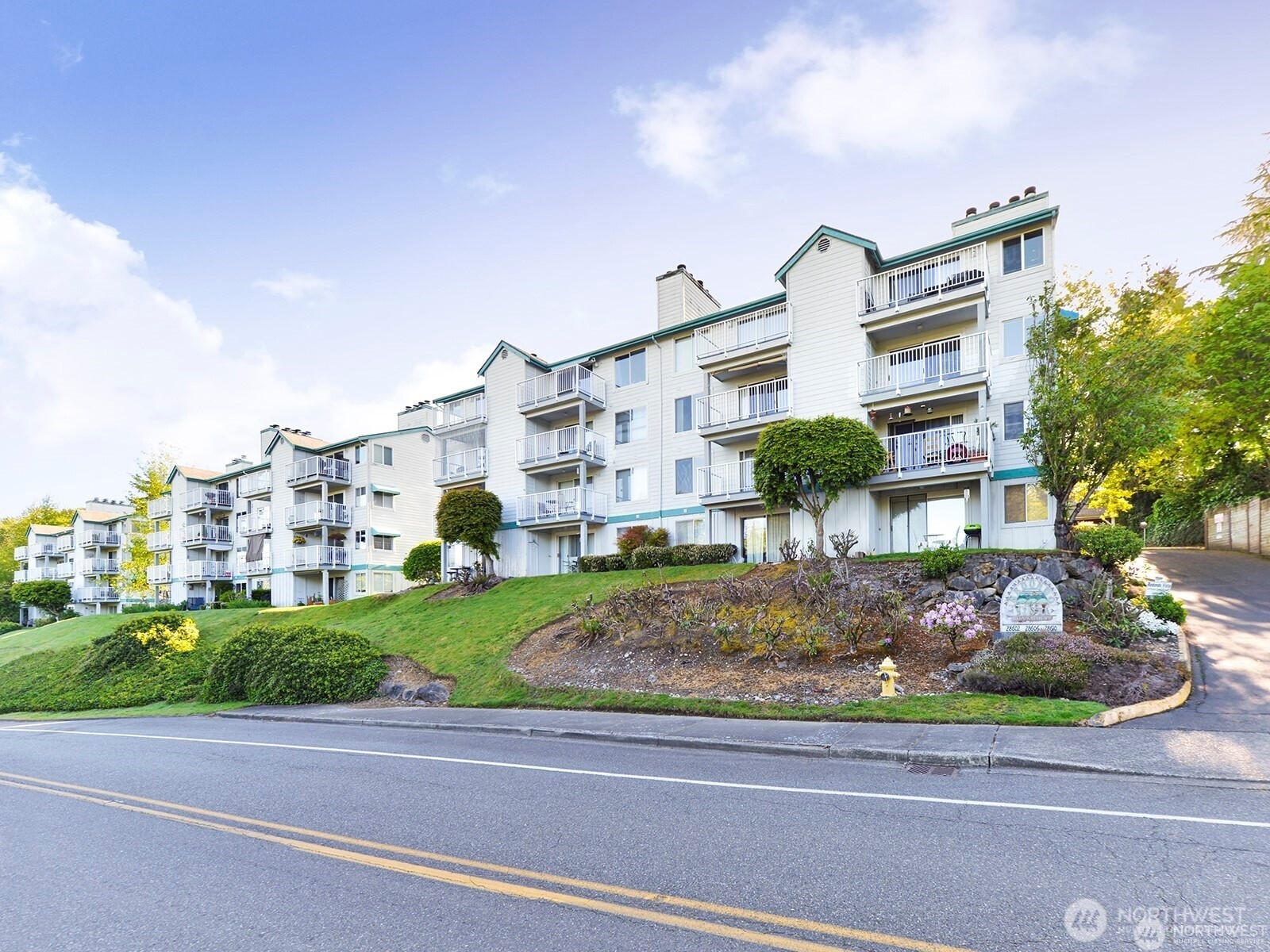 28606 16th Avenue South, Unit 102 Federal Way, WA 98003 - Photo 21 of 22 a front view of a house with a yard
