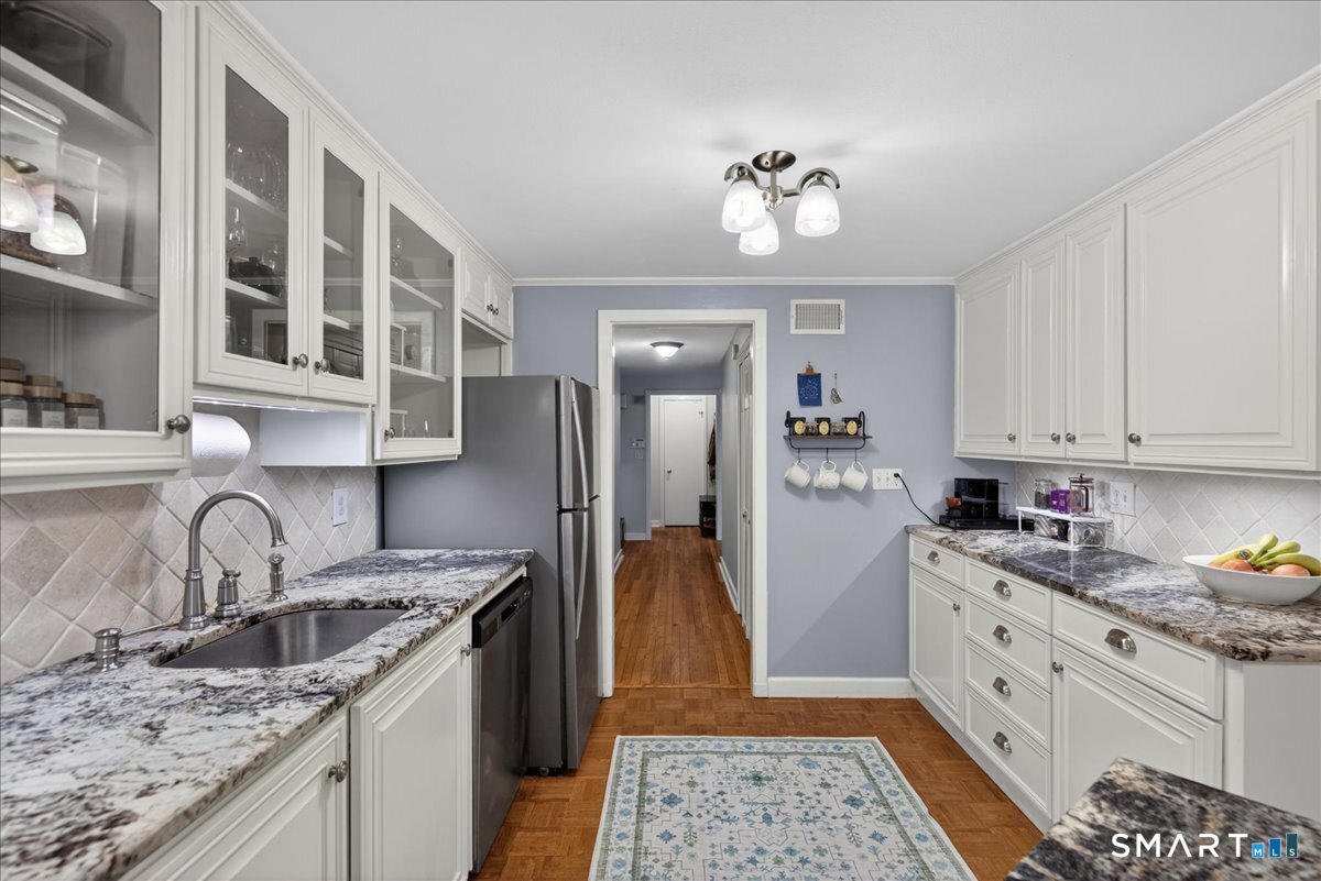54 Jackson Road Hamden, CT 06517 - Photo 12 of 40 a kitchen with a sink stove and refrigerator