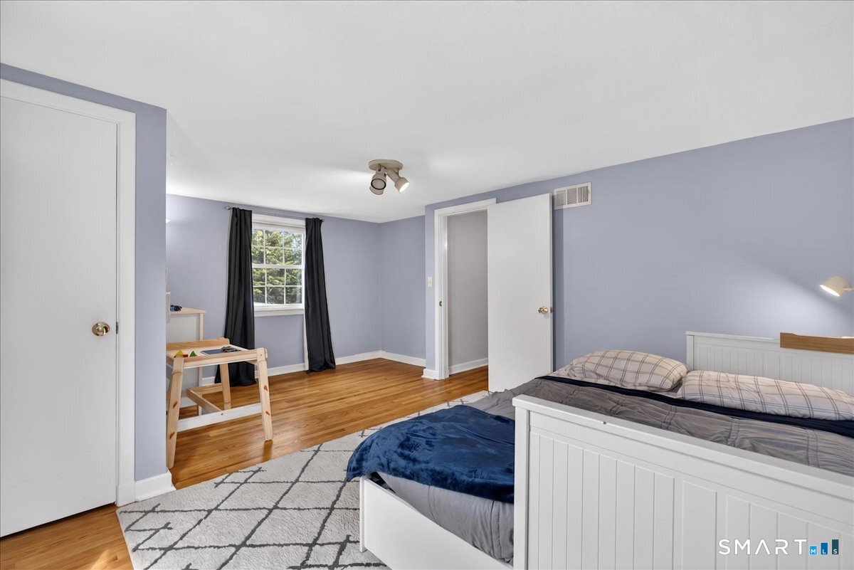54 Jackson Road Hamden, CT 06517 - Photo 23 of 40 a bedroom with a bed and window