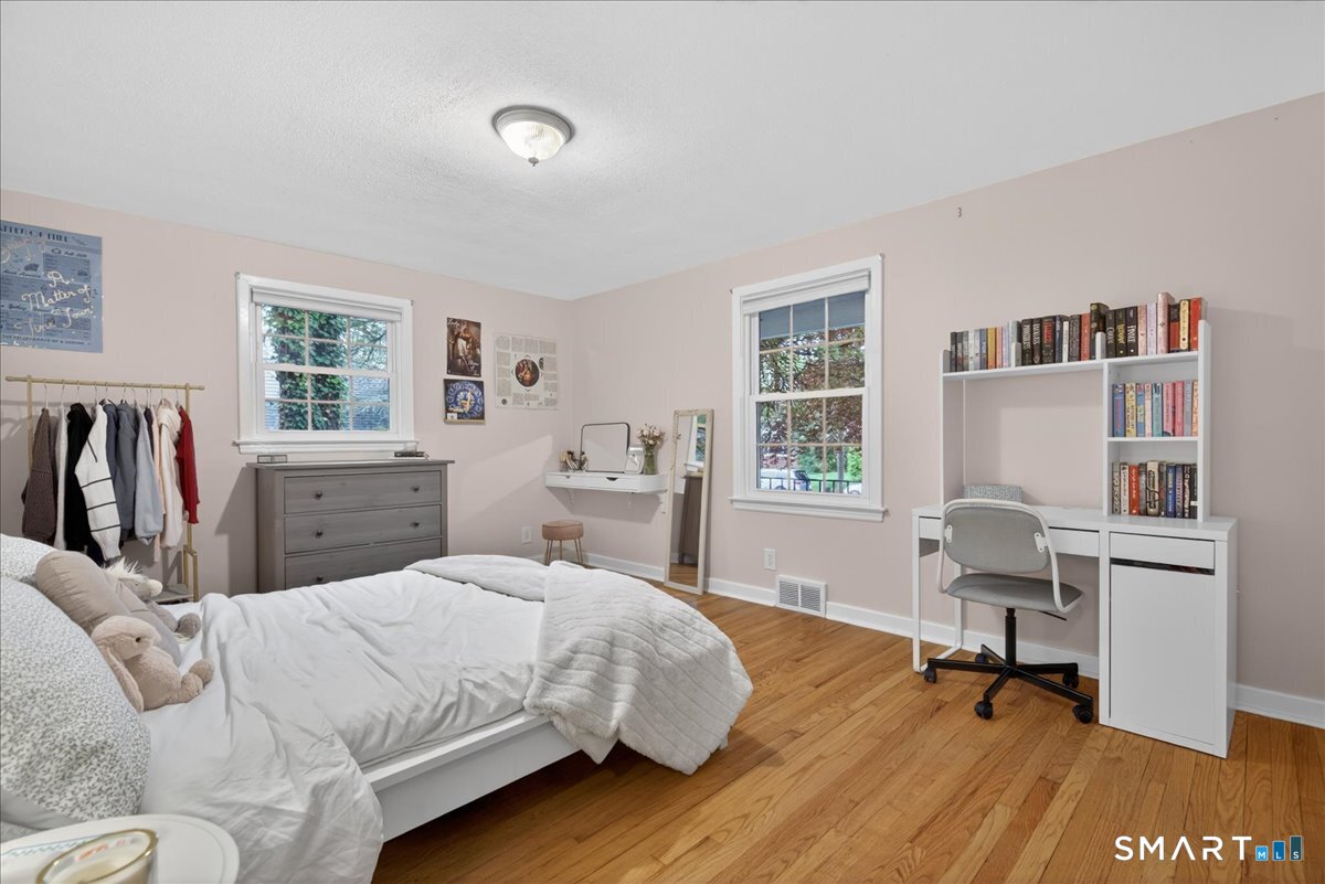 54 Jackson Road Hamden, CT 06517 - Photo 24 of 40 a bedroom with a bed and a chair in it