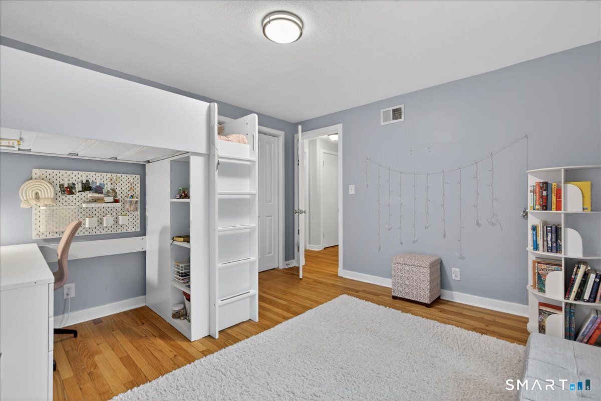 54 Jackson Road Hamden, CT 06517 - Photo 27 of 40 a view of livingroom with hardwood floor and workspace