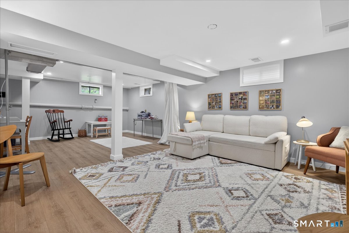 54 Jackson Road Hamden, CT 06517 - Photo 29 of 40 a living room with furniture and a table