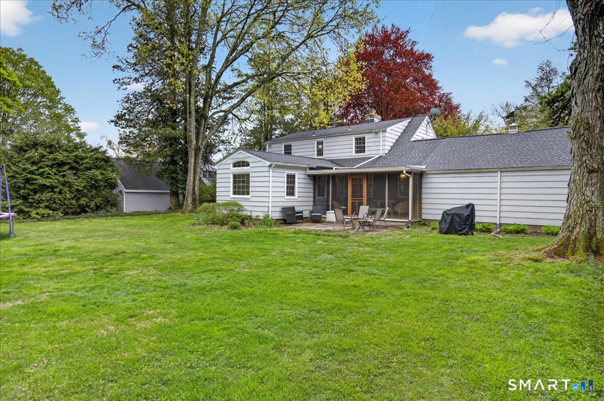 54 Jackson Road Hamden, CT 06517 - Photo 32 of 40 a front view of a house with a garden and yard