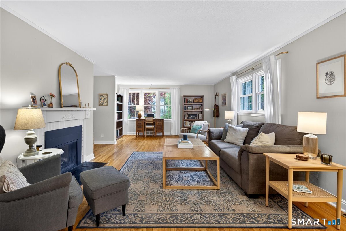 54 Jackson Road Hamden, CT 06517 - Photo 6 of 40 a living room with furniture and a fireplace