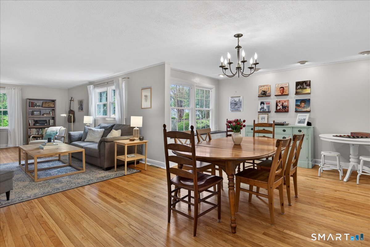 54 Jackson Road Hamden, CT 06517 - Photo 7 of 40 a view of a dining room with furniture window and wooden floor