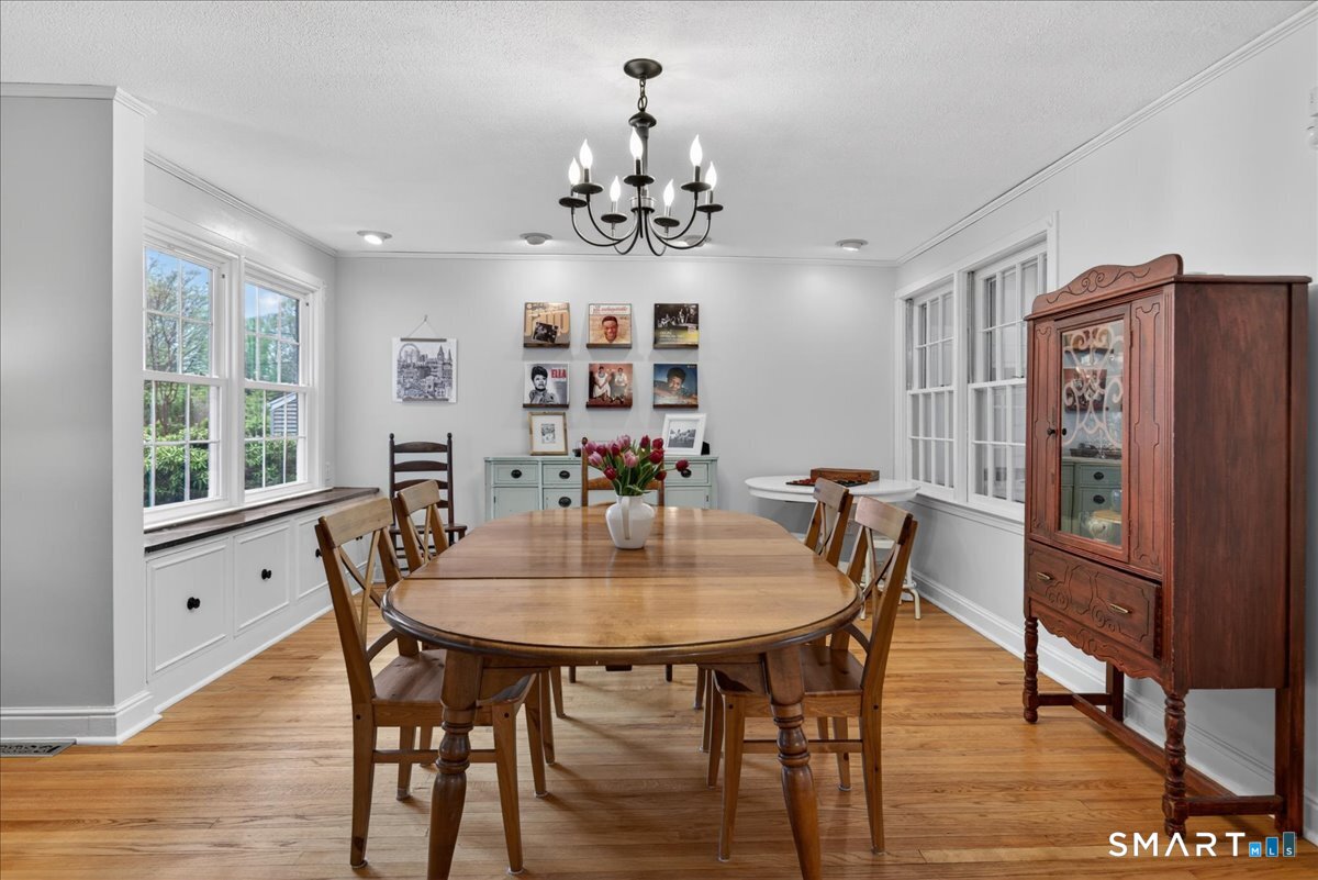 54 Jackson Road Hamden, CT 06517 - Photo 8 of 40 a view of a dining room with furniture window and wooden floor