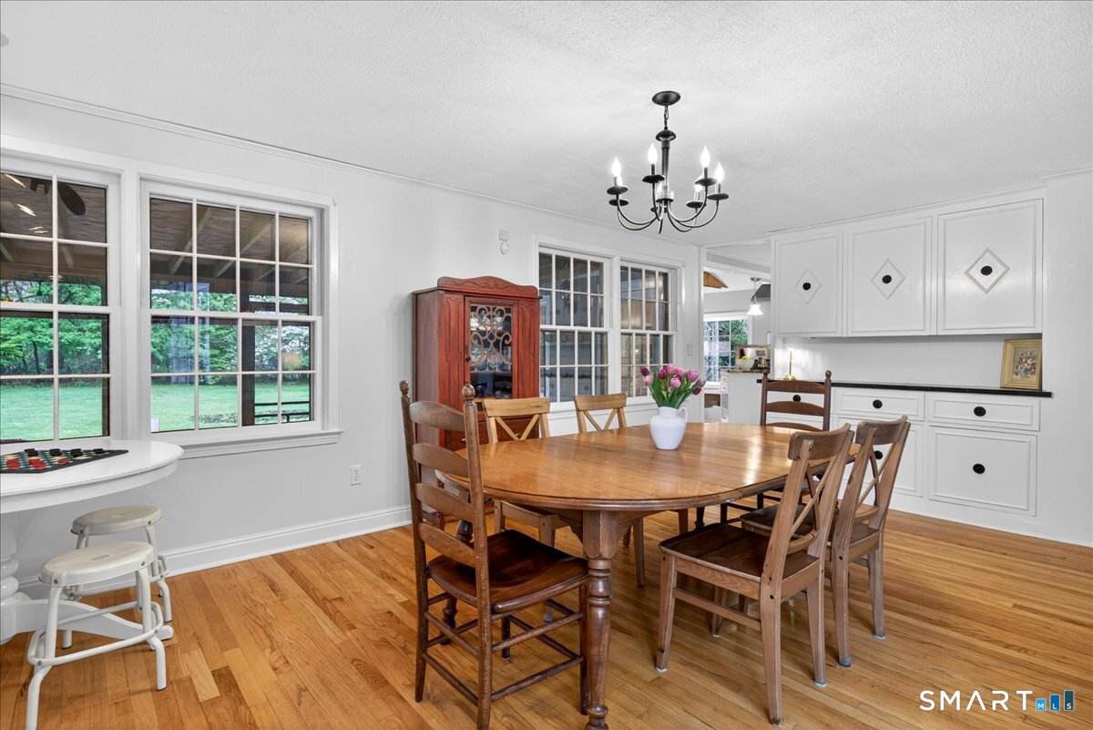 54 Jackson Road Hamden, CT 06517 - Photo 9 of 40 a view of a dining room with furniture window and outside view