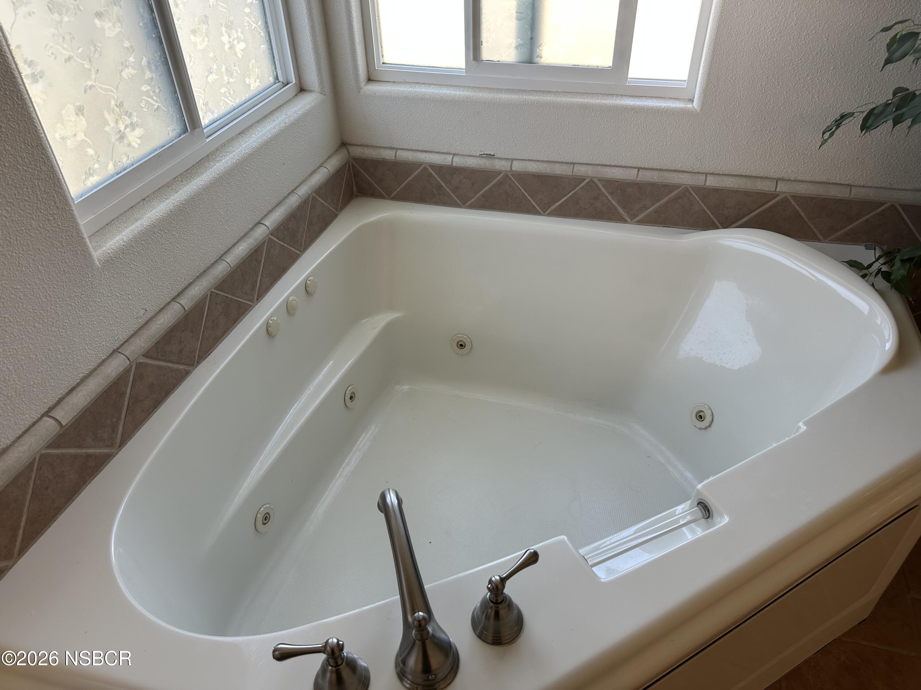 192 East Branch Street Nipomo, CA 93444 - Photo 17 of 26 a bathroom with a tub and a window