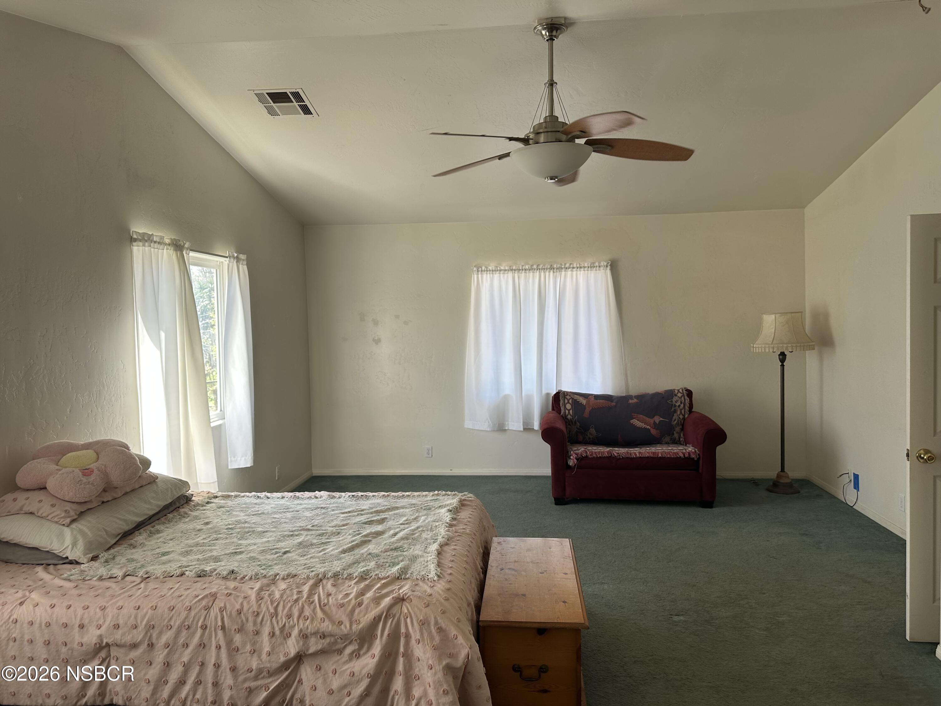 192 East Branch Street Nipomo, CA 93444 - Photo 22 of 26 a bedroom with a bed and a couch
