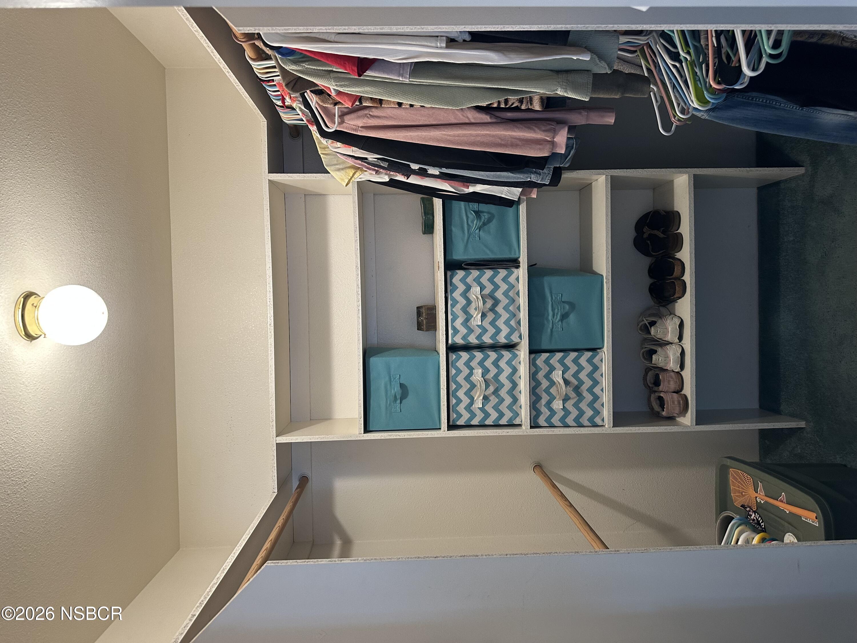 192 East Branch Street Nipomo, CA 93444 - Photo 23 of 26 a view of walk in closet with clothes and shoes