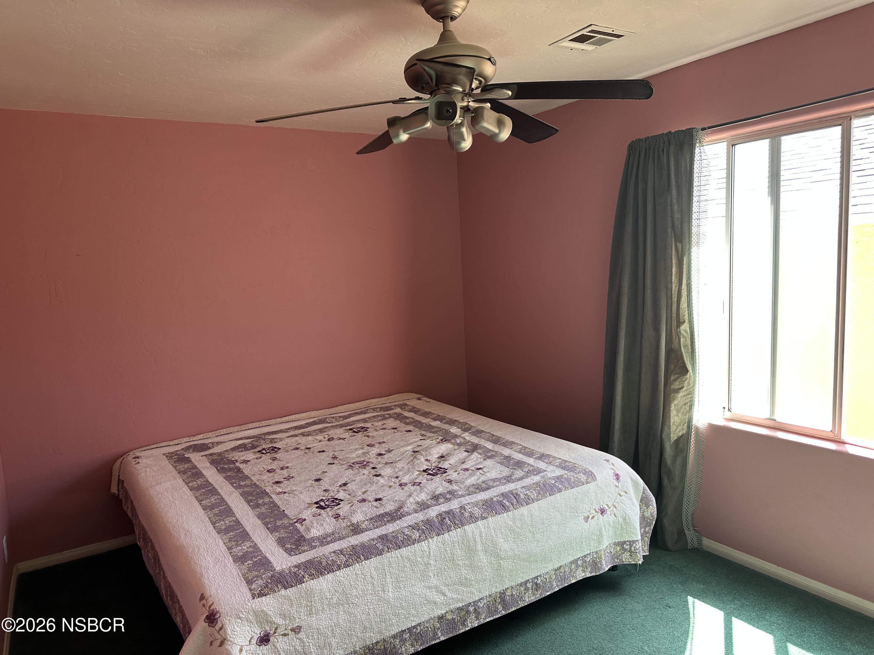 192 East Branch Street Nipomo, CA 93444 - Photo 24 of 26 a bedroom with a bed and a window