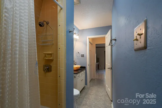 a view of a hallway with closet