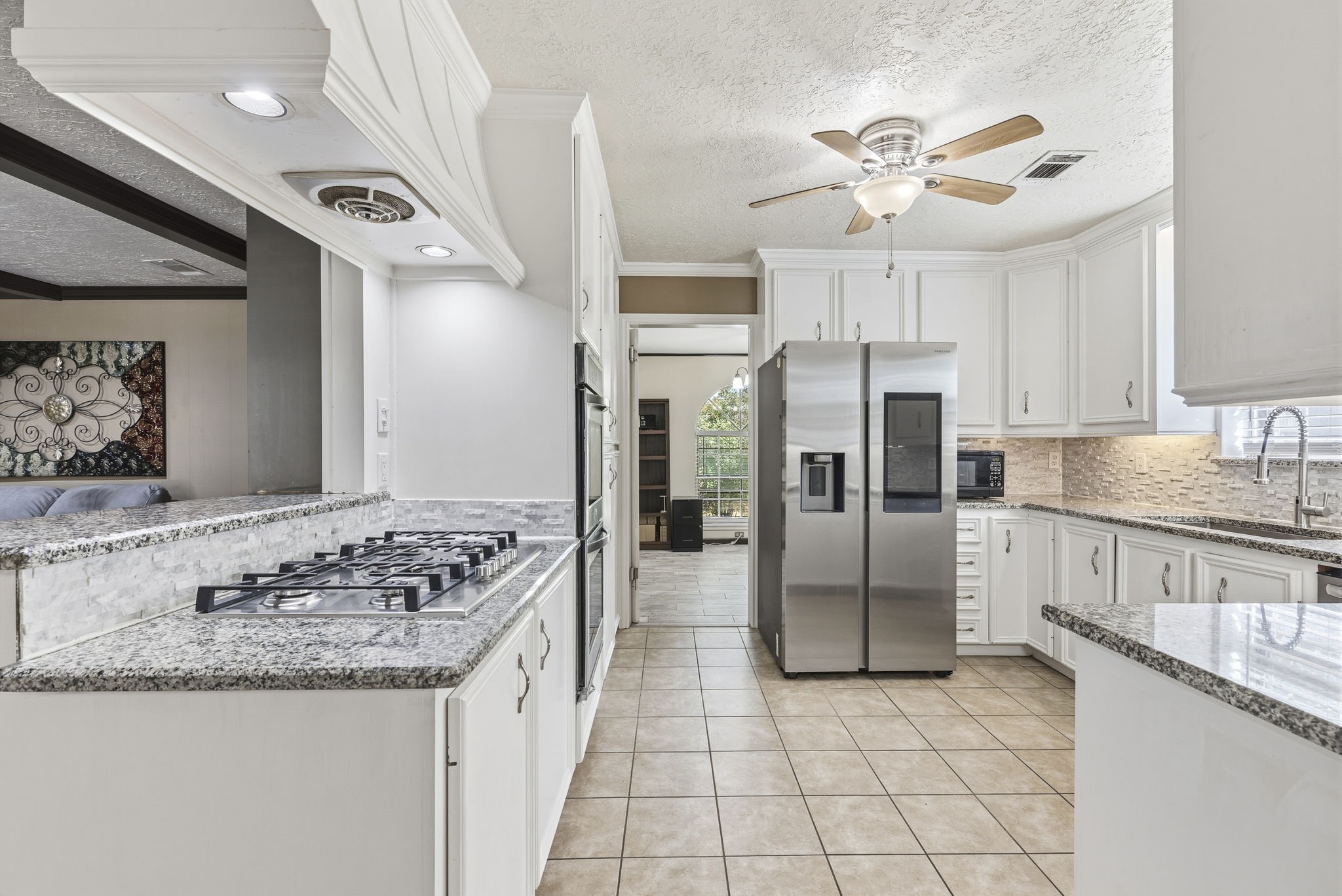 17603 Loring Lane Spring, TX 77388 - Photo 14 of 50 a kitchen with stainless steel appliances granite countertop a sink stove and refrigerator