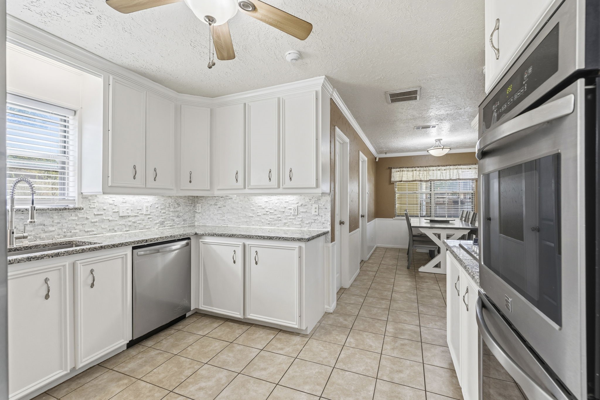 17603 Loring Lane Spring, TX 77388 - Photo 15 of 50 a kitchen with granite countertop a sink and cabinets