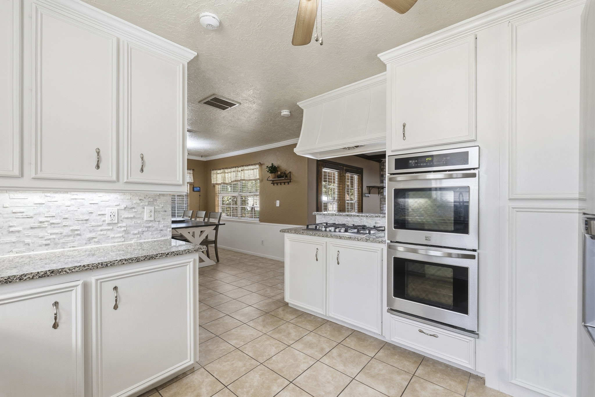 17603 Loring Lane Spring, TX 77388 - Photo 16 of 50 a kitchen with cabinets and oven