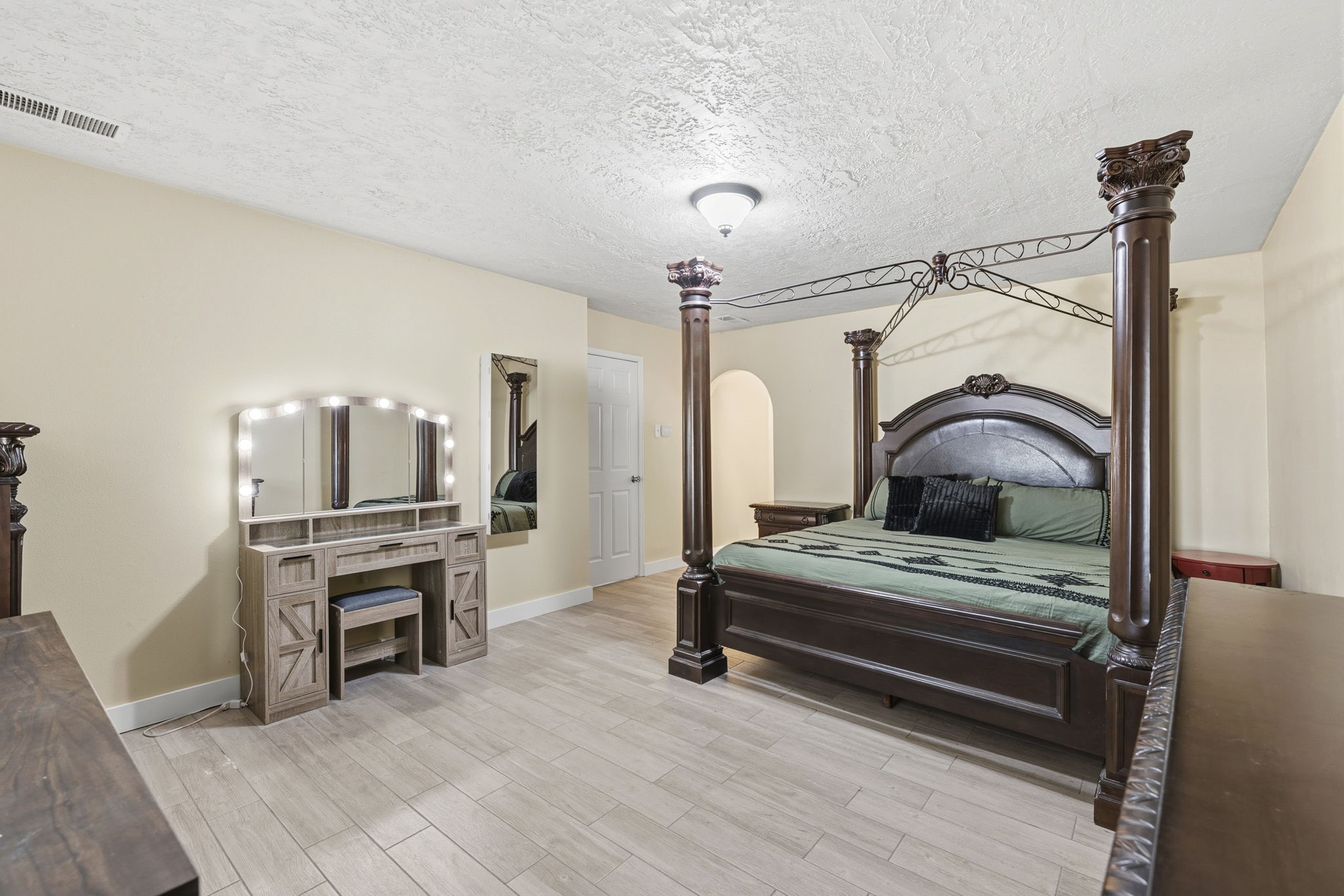 17603 Loring Lane Spring, TX 77388 - Photo 23 of 50 a bedroom with furniture and a chandelier