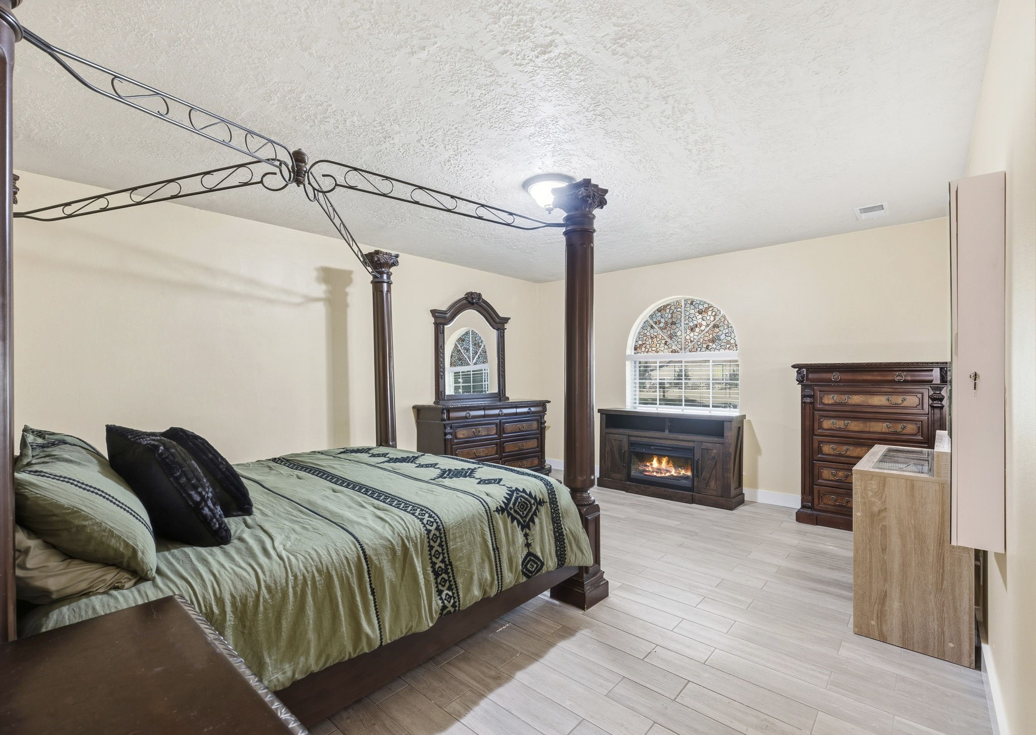 17603 Loring Lane Spring, TX 77388 - Photo 25 of 50 a bedroom with a bed and a fireplace