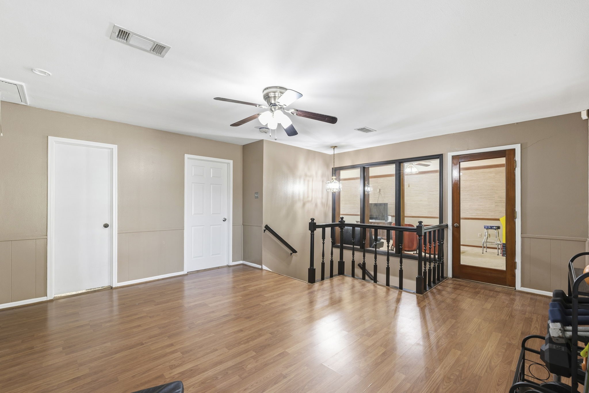 17603 Loring Lane Spring, TX 77388 - Photo 32 of 50 a view of a livingroom with furniture wooden floor and chandelier