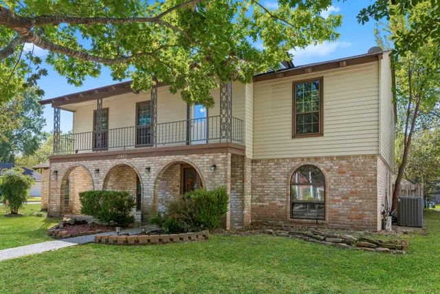 front view of a house with a garden