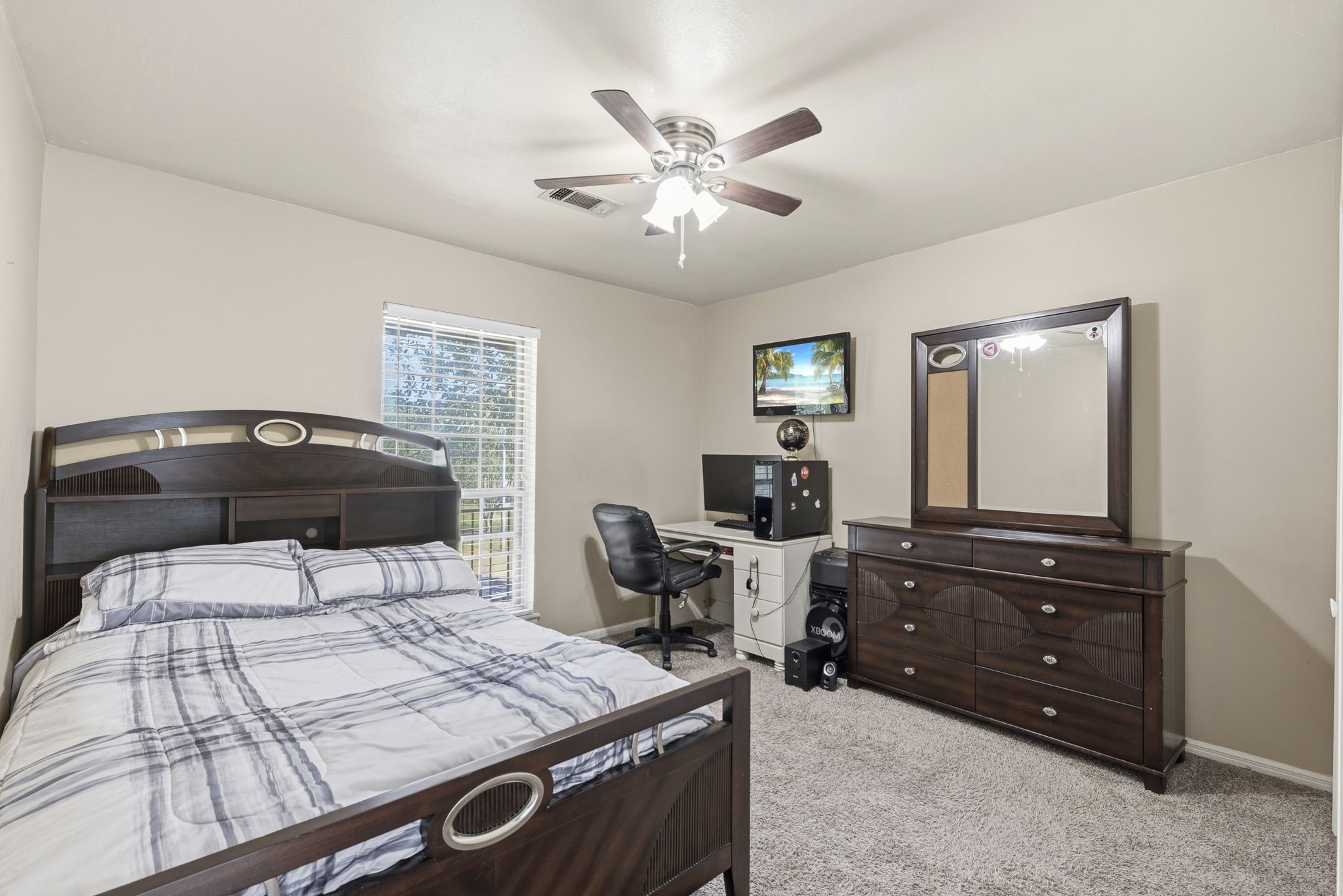 17603 Loring Lane Spring, TX 77388 - Photo 41 of 50 a bedroom with a bed and a dresser