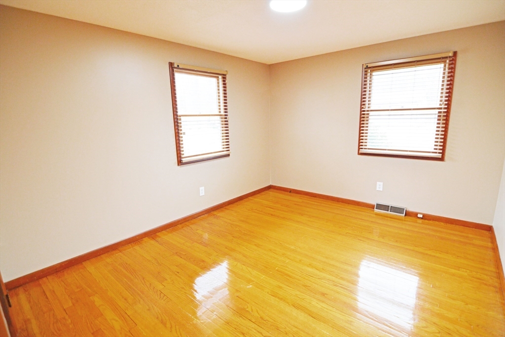 122 Garnet Street Springfield, MA 01129 - Photo 14 of 36 a view of a room with a bed and a window