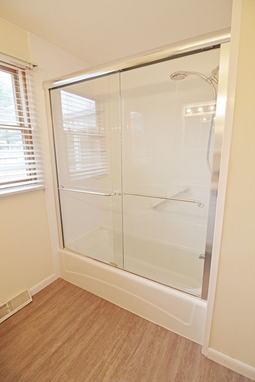 122 Garnet Street Springfield, MA 01129 - Photo 19 of 36 a bathroom with a glass shower door