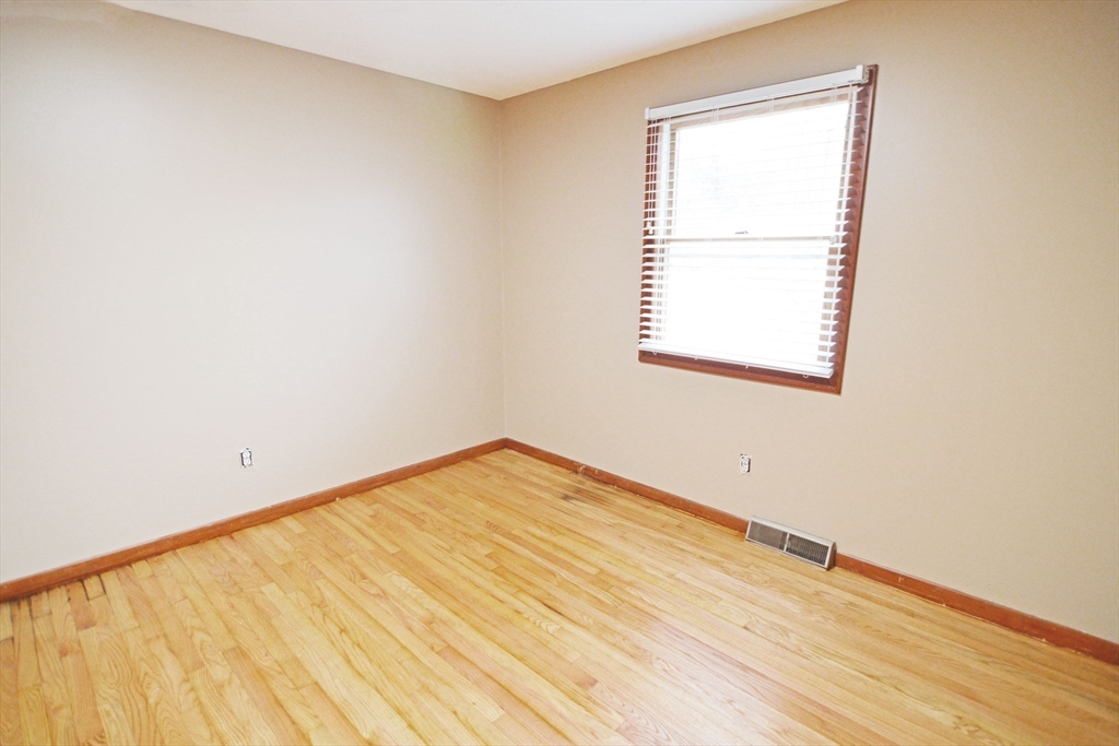 122 Garnet Street Springfield, MA 01129 - Photo 22 of 36 an empty room with a window