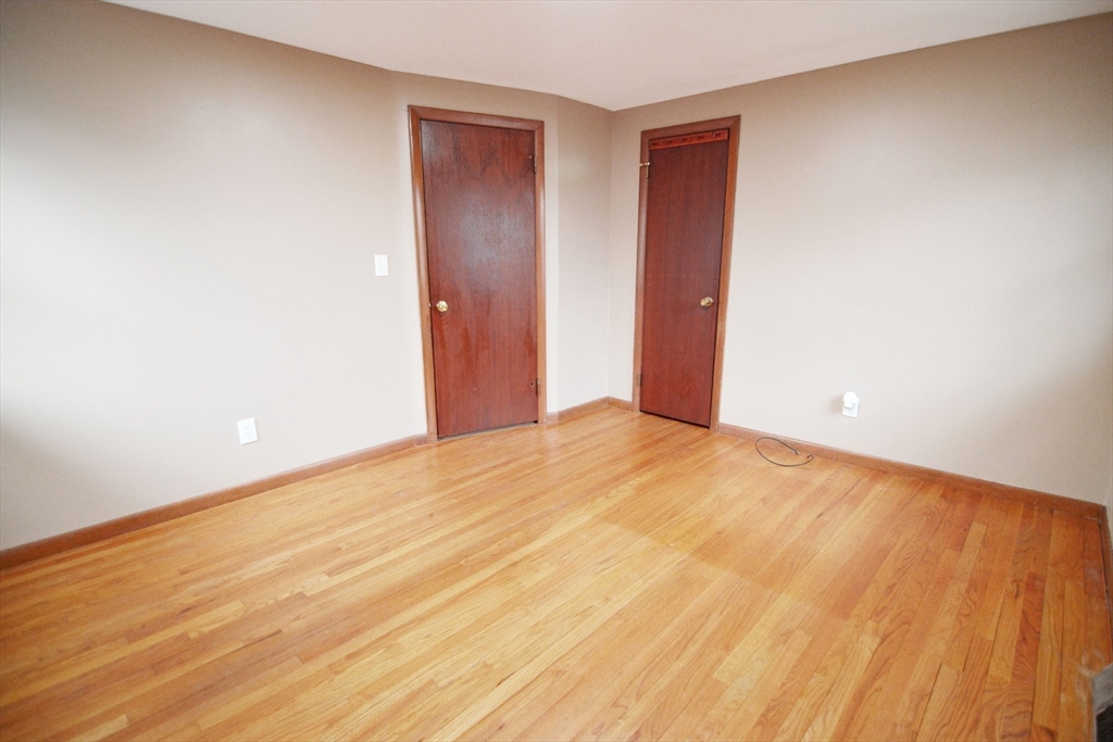 122 Garnet Street Springfield, MA 01129 - Photo 25 of 36 a view of an empty room and wooden floor