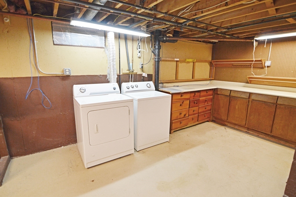 122 Garnet Street Springfield, MA 01129 - Photo 26 of 36 a utility room with dryer and washer