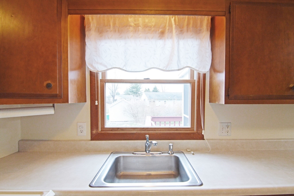 122 Garnet Street Springfield, MA 01129 - Photo 7 of 36 a bathroom with a sink and a window