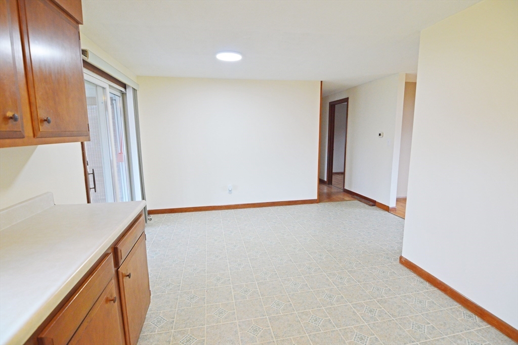 122 Garnet Street Springfield, MA 01129 - Photo 9 of 36 a view of an empty room and wooden floor