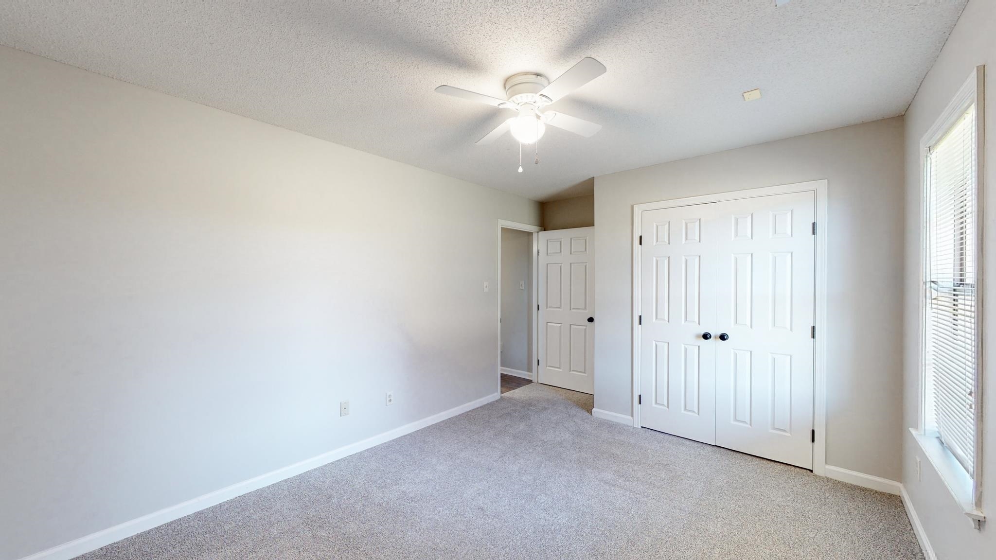 8629 Brunswick Road Millington, TN 38053 - Photo 15 of 25 an empty room with fan and fan