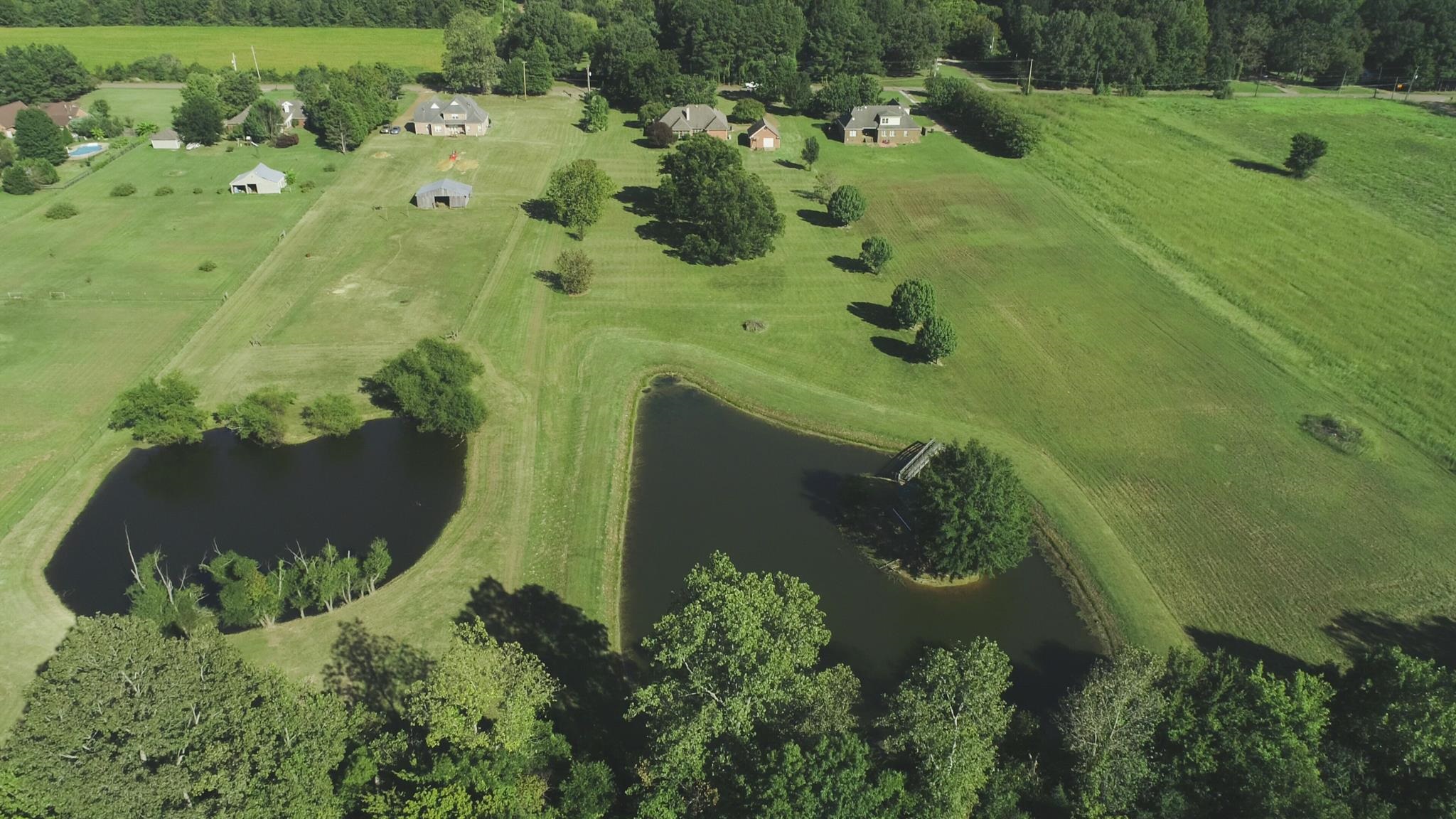 8629 Brunswick Road Millington, TN 38053 - Photo 22 of 25 an aerial view of residential house with pool and trees