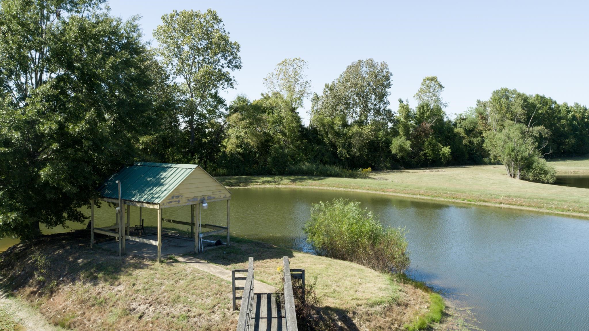 8629 Brunswick Road Millington, TN 38053 - Photo 24 of 25 a view of a lake with a patio