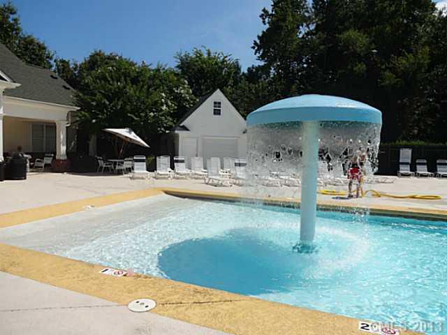 10125 Westmoreland Road, Unit IB Cornelius, NC 28031 - Photo 16 of 16 a view of a house with swimming pool and sitting area