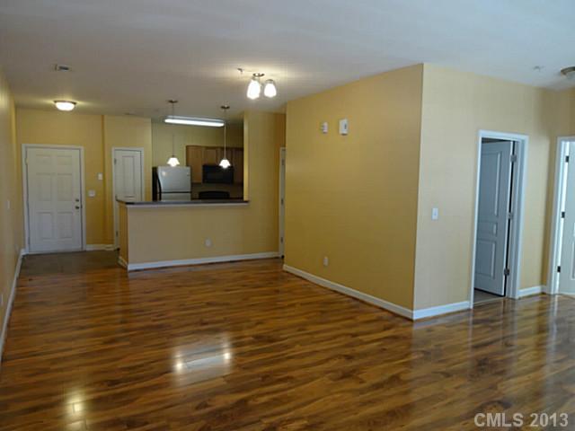 10125 Westmoreland Road, Unit IB Cornelius, NC 28031 - Photo 6 of 16 a view of a livingroom with wooden floor