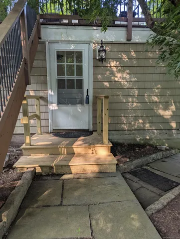 a front view of a house with chairs