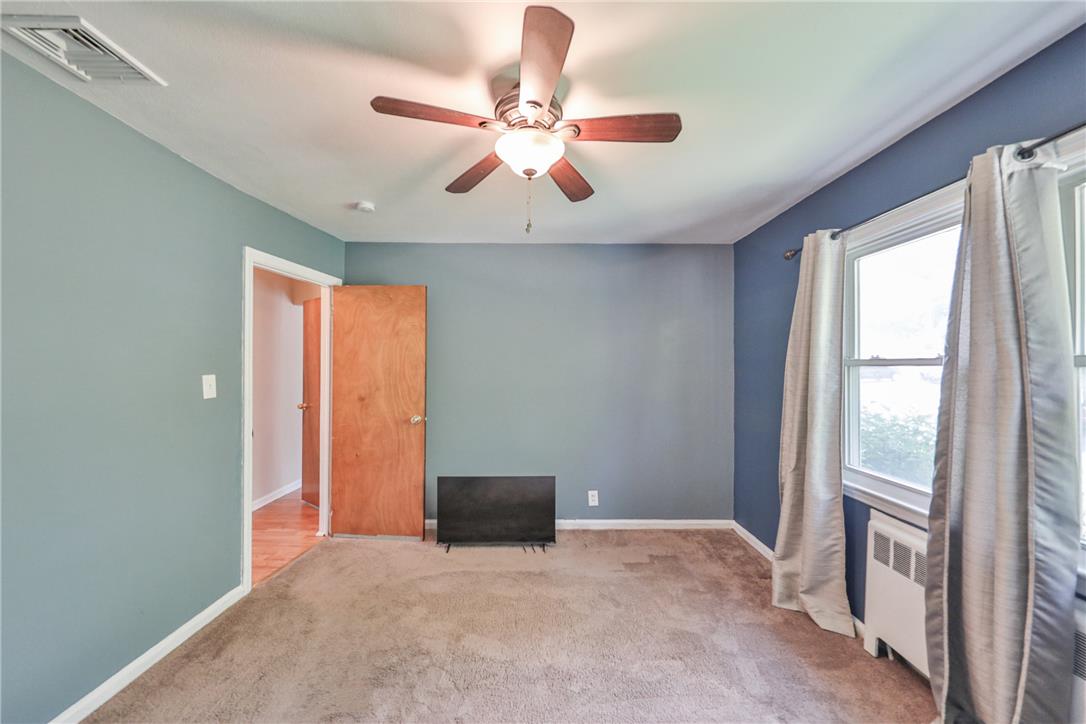 3050 Cornwall Road Bethlehem, PA 18017 - Photo 34 of 80 A well-proportioned bedroom with carpeting and a prominent ceiling fan for comfort.