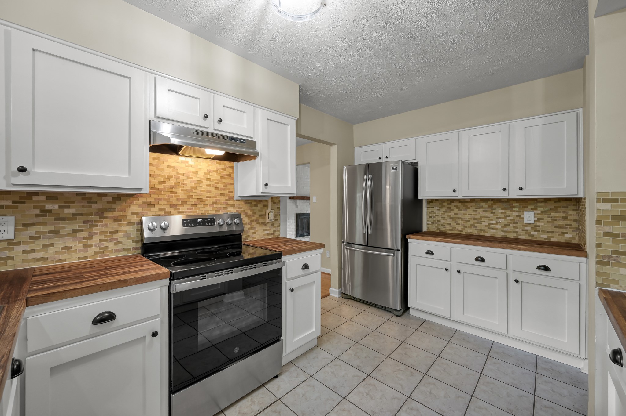 12224 Gun Oak Place Spring, TX 77380 - Photo 18 of 37 Bright and Functional Kitchen with Ample Counter Space and Storage