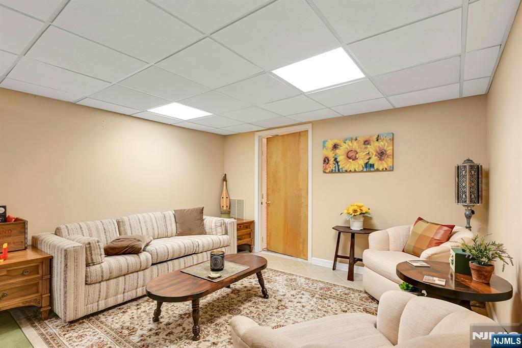 285 Chestnut Ridge Road Woodcliff Lake, NJ 07677 - Photo 43 of 46 a living room with furniture and wooden floor