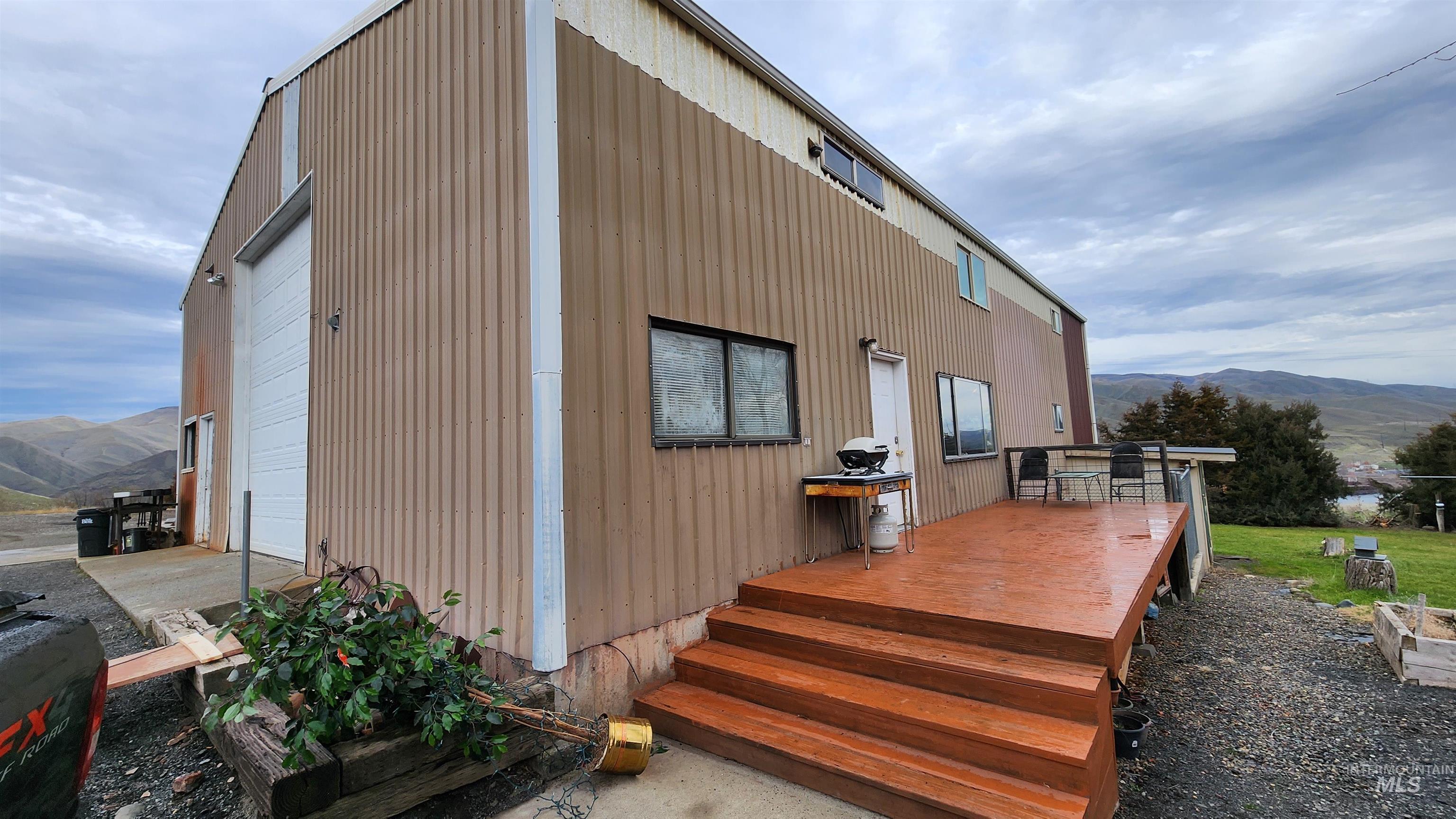 802 Evans Road Clarkston, WA 99403 - Photo 1 of 22 Metal-sided shop-home structure with a large overhead door and a separate entry door