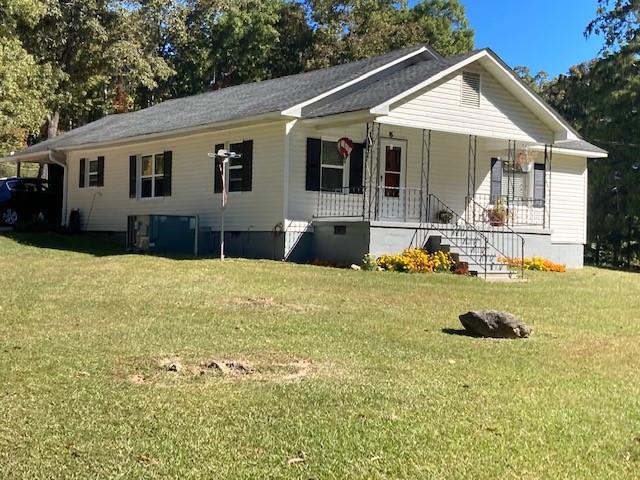 1620 Cunningham Road Southwest Rome, GA 30161 - Photo 1 of 1 a front view of a house with yard and green space