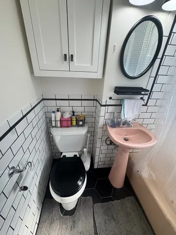 a bathroom with a toilet and a sink