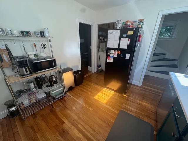 a view of a living room with furniture and a flat screen tv